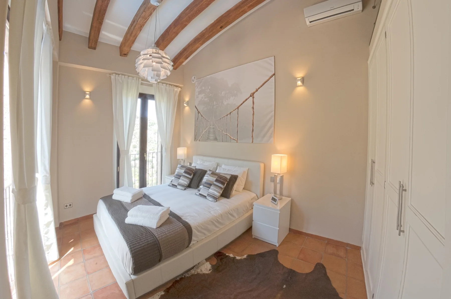 Master bedroom with bridge artwork